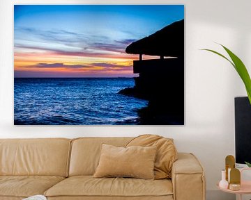 Beach house at colourful sunset by Joke Van Eeghem