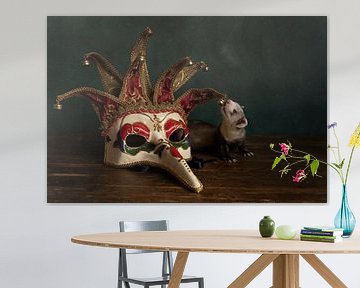 Still life of a ferret pup with a Venetian or Carnival mask against a green background by Leoniek van der Vliet