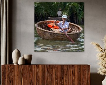 man in boat on mekong river van Bram de Muijnck