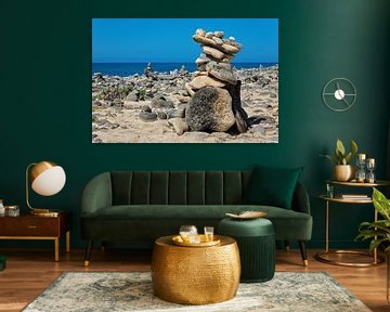 Stacked boulders as a symbol on the coast of the island of Bonaire by Ben Schonewille