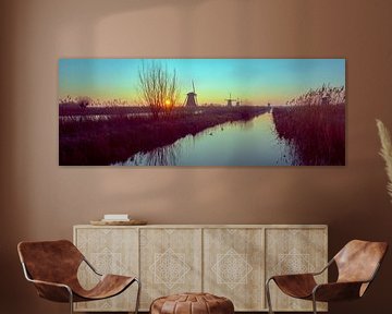 Panorama du lever du soleil sur les moulins de Kinderdijk sur Angel Flores