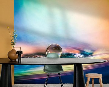 Macro of a water drip in colourful surroundings by Bert Nijholt