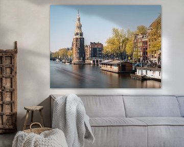 Montelbaan tower, canal and old houses in Amsterdam, the Netherlands. by Lorena Cirstea