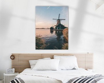 Windmill with airplane line in Zaanse Schans just after sunset