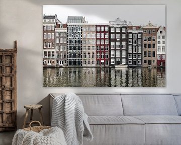 Huizen aan het Damrak in Amsterdam van Noé Pierre