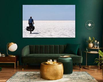 Cyclist traversing a salt pan by Jeroen Kleiberg