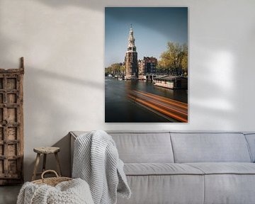 Montelbaan tower, canal and old houses in Amsterdam, the Netherlands. by Lorena Cirstea