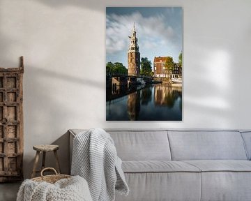 Montelbaan tower, canal and old houses in Amsterdam, the Netherlands. by Lorena Cirstea