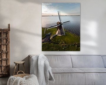 Mill on the waterfront in the Frisian landscape