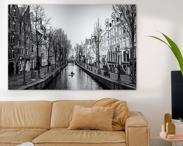 Canoeing on the canals of Amsterdam. by Friso Kooijman