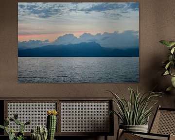 Sunset, lake, mountains and clouds.