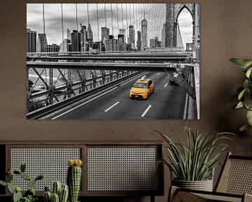 Yellow Cab on Brooklyn Bridge black and white by Natascha Velzel