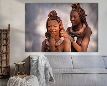 Namibia. Himba tribe. Girls arrange each other's hair.