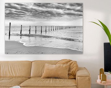 Poles in the water, Maasvlakte beach in black and white by Marjolein van Middelkoop