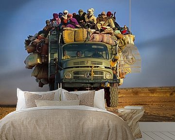 Truck with people in Sahara desert by Frans Lemmens
