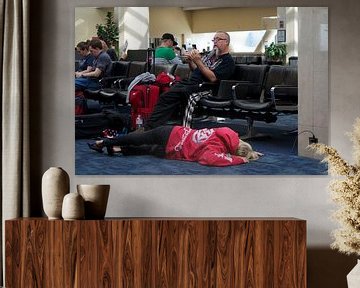 A power nap at the airport by Anjo Schuite