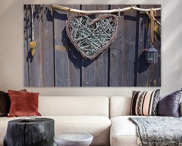 A rustic heart in front of a wooden wall by Ulrike Leone