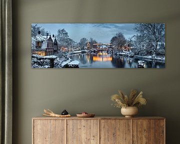 Illuminated Christmas tree and drawbridge in Vreeland on the Vecht River, Netherlands. by Frans Lemmens