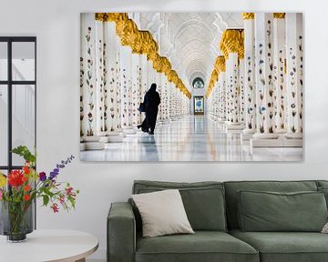 Woman in gallery of Sheikh Zayed Grand Mosque in Abu Dhabi