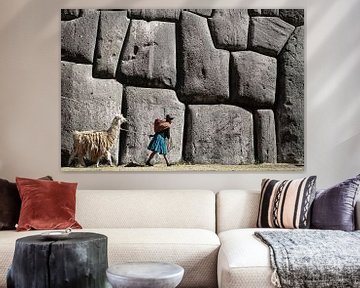 Girl with llama at Sacsayhuaman Inca ruins near Cusco, Peru