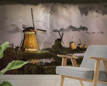 Lightning at the illuminated windmills of Kinderdijk by Frans Lemmens
