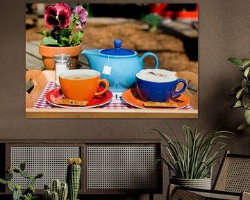 Coffee and tea drinks on terrace outdoor by Ivonne Wierink