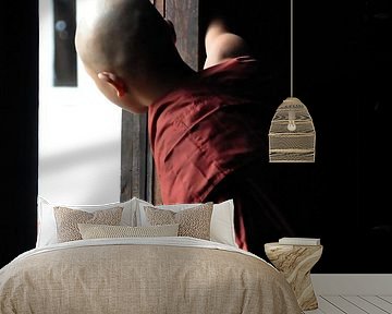 Monk looks outside from his wooden monastery of Shwe Yaunghwe by Affect Fotografie