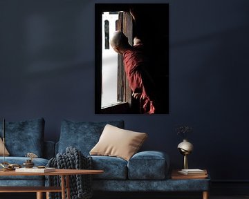 Monk looks outside from his wooden monastery of Shwe Yaunghwe by Affect Fotografie