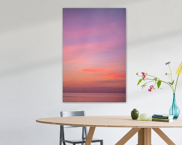 Pink orange sunset sky over the sea by Charlotte Van Der Gaag