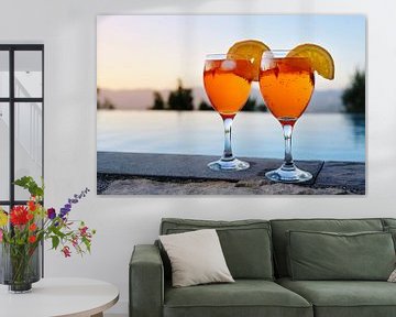 two glasses with Spritz Veneziano, an Italian cocktail drink from aperol, prosecco and soda on a wal by Maren Winter