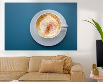 cup of cappuccino with cocoa powder on a blue background, view directly from above, copy space, sele by Maren Winter