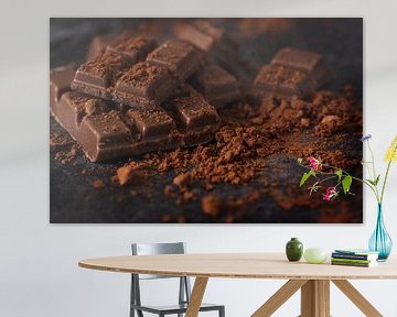chocolate and cocoa powder on a dark slate plate, macro shot, selected focus, narrow depth of field by Maren Winter