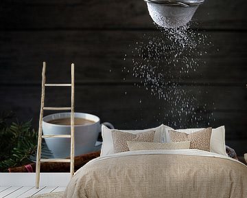 christmas cake, in germany christstollen is sprinkled with icing sugar, coffee cup, spices and cinna by Maren Winter