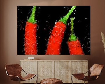 Red peppers under water