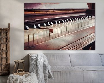 old vintage piano keyboard, one key is pressed, music concept in warm color toned retro style, selec by Maren Winter