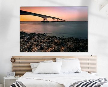 Seebrücke mit Sonnenuntergang von Björn van den Berg