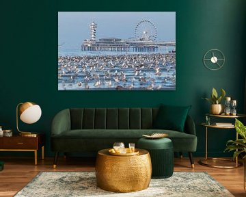 Overcrowded beach with seagulls with the Scheveningen Pier in the background by Anne Zwagers