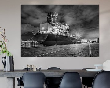 Moored illuminated tanker at night by Tony Vingerhoets