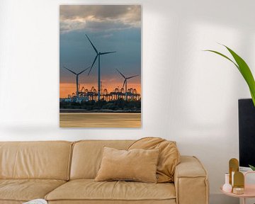 Riverbank with windmills at colored sunset by Tony Vingerhoets