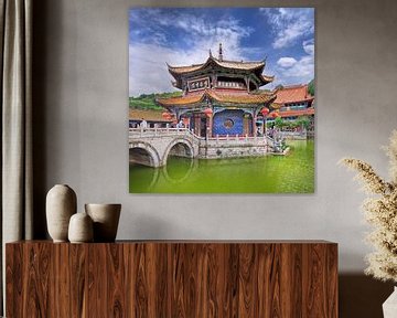 Yuantong Temple against a blue sky with dramatic clouds by Tony Vingerhoets