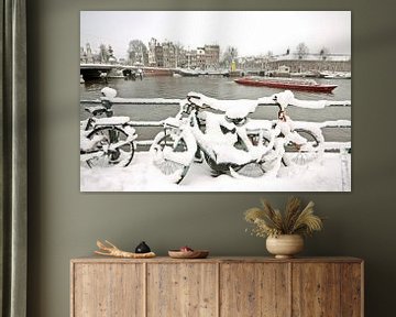 Snowy bikes on the river Amstel in Amsterdam by Eye on You