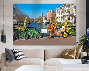 Decorated bicycles with flowers on the canal in Amsterdam by Eye on You