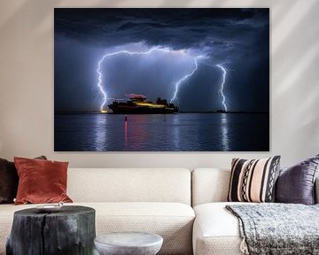 Ship sails out during a severe thunderstorm by Menno van der Haven