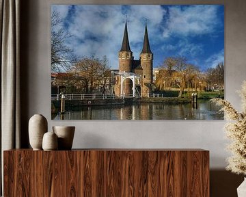 The Oostpoort in Delft in a picturesque setting by Gert van Santen