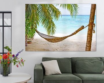 Hammock on a tropical beach by Henny Hagenaars