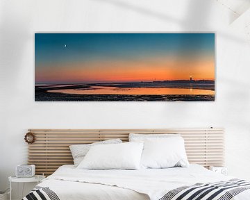Vue panoramique d'un coucher de soleil avec les Brandaris sur Terschelling