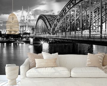 Cologne Cathedral and Hohenzollern Bridge in Cologne / black and white by Werner Dieterich