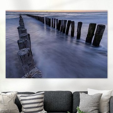 Wellenbrecher bei Sonnenuntergang in Dishoek