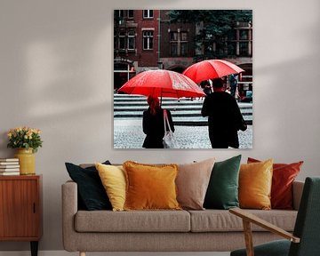 Red umbrellas in Amsterdam by Rutger van Loo