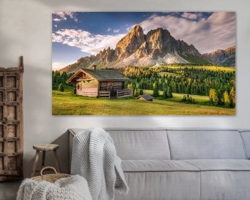 Alpine hut on a mountain pasture in the Alps / Dolomites in Italy